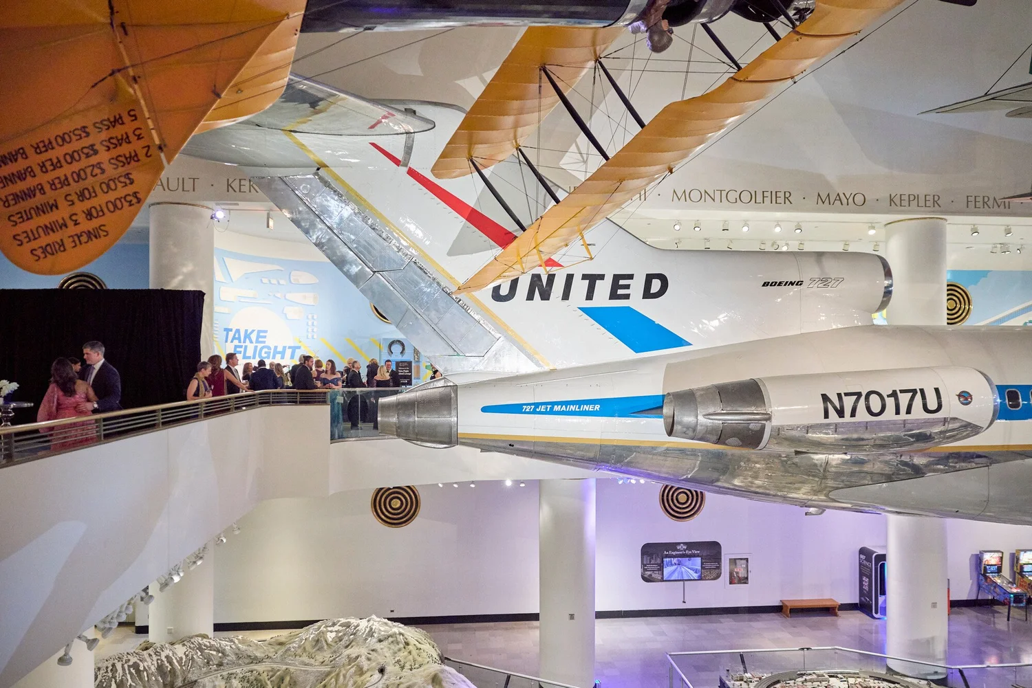 United 727 and biplane above the Take Flight balcony