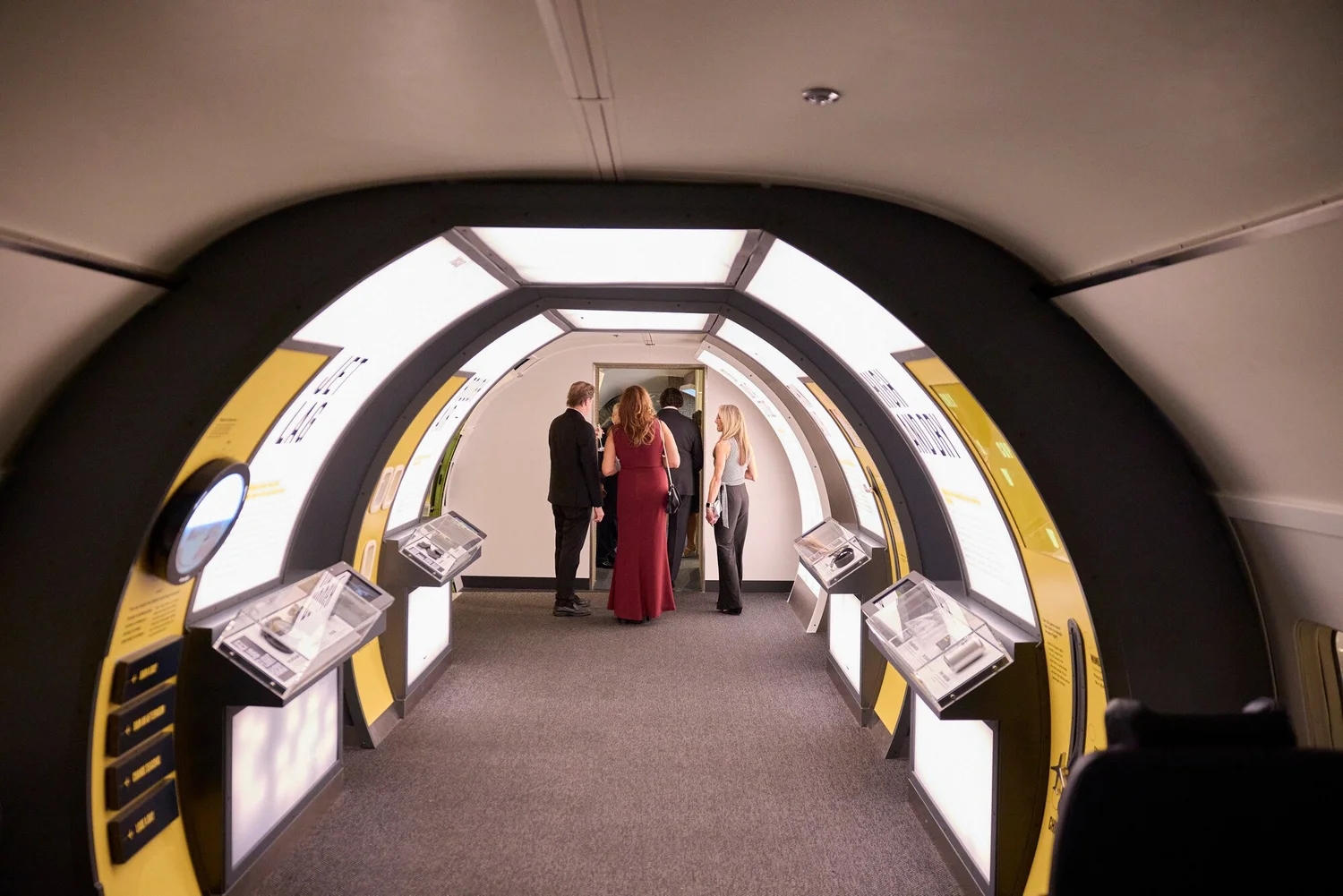 Guests walking through the lit Jet Lag exhibit tunnel