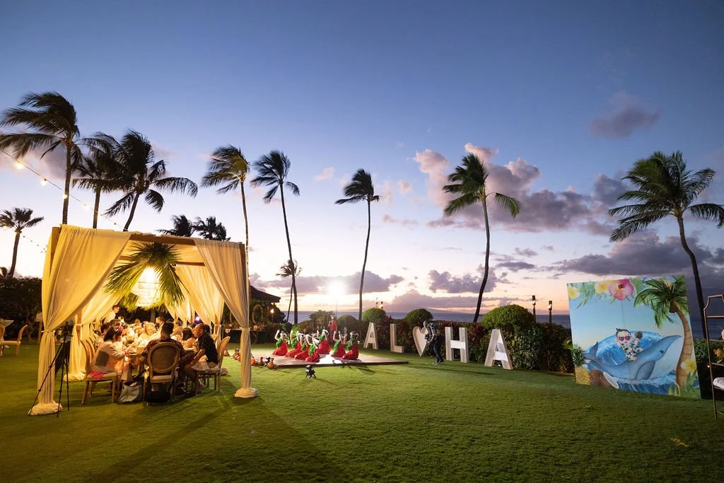 ALOHA marquee and hula performance at dusk for Gio's first birthday luau
