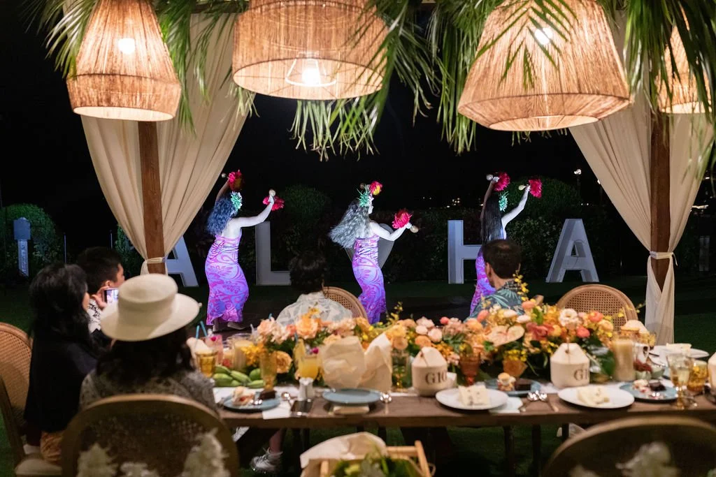 Dinner cabana with hula dancers and ALOHA letters at night