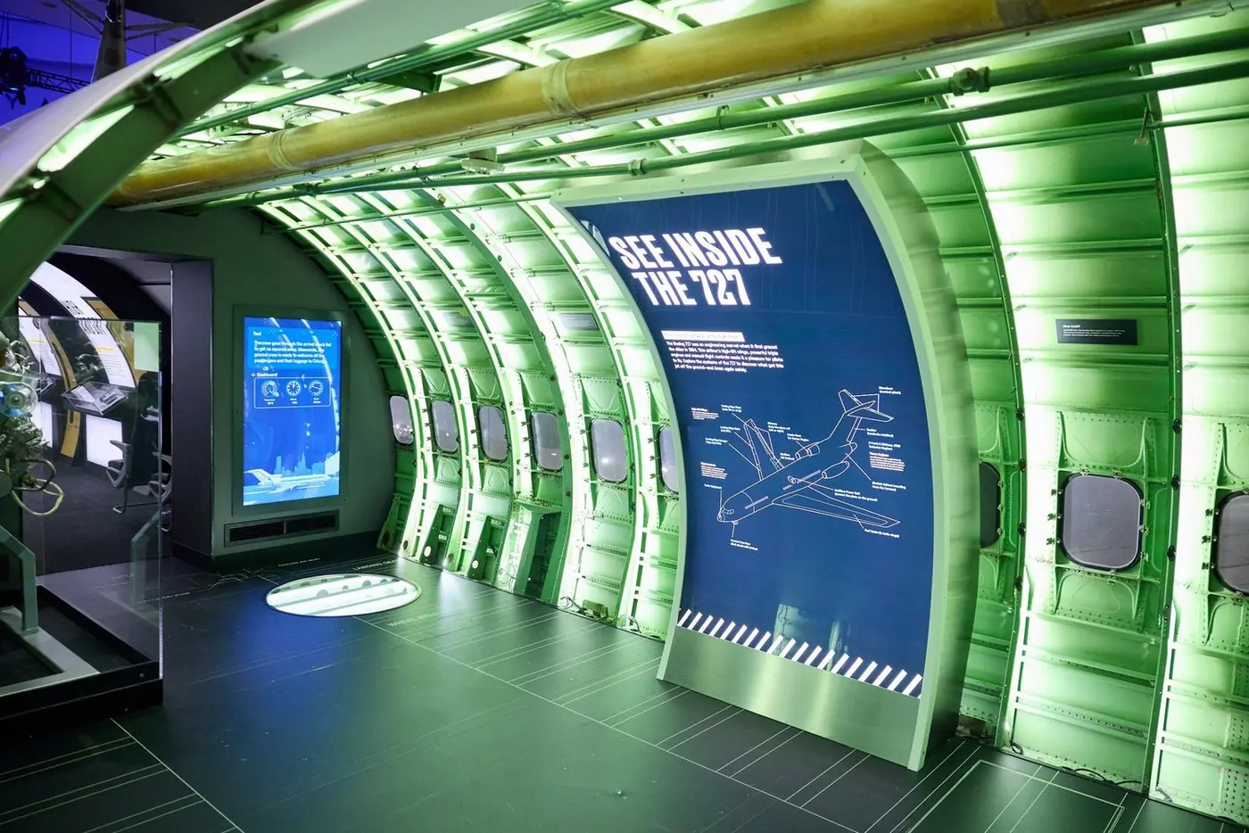 See Inside the 727 exhibit with neon green fuselage lighting