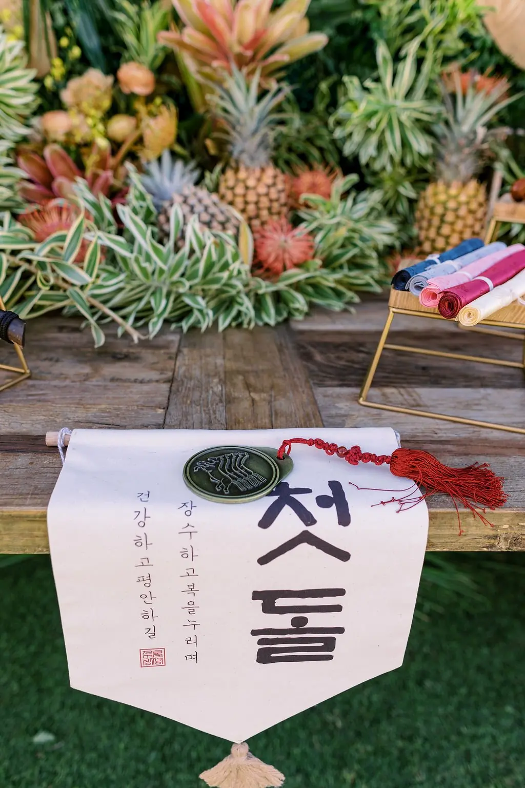 Korean first-birthday banner and doljabi details at Gio's Maui celebration