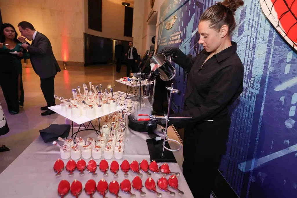 Science-themed dessert station with dry ice at the Columbian Ball