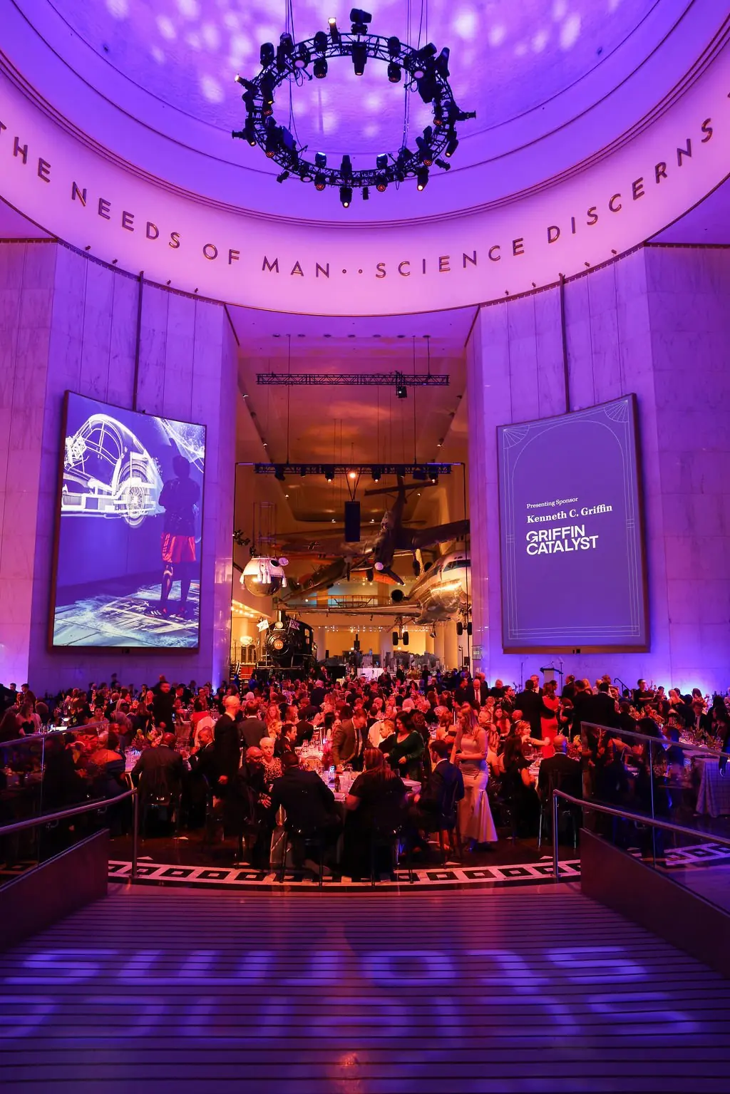 Elevated view of the purple-lit Columbian Ball dining room