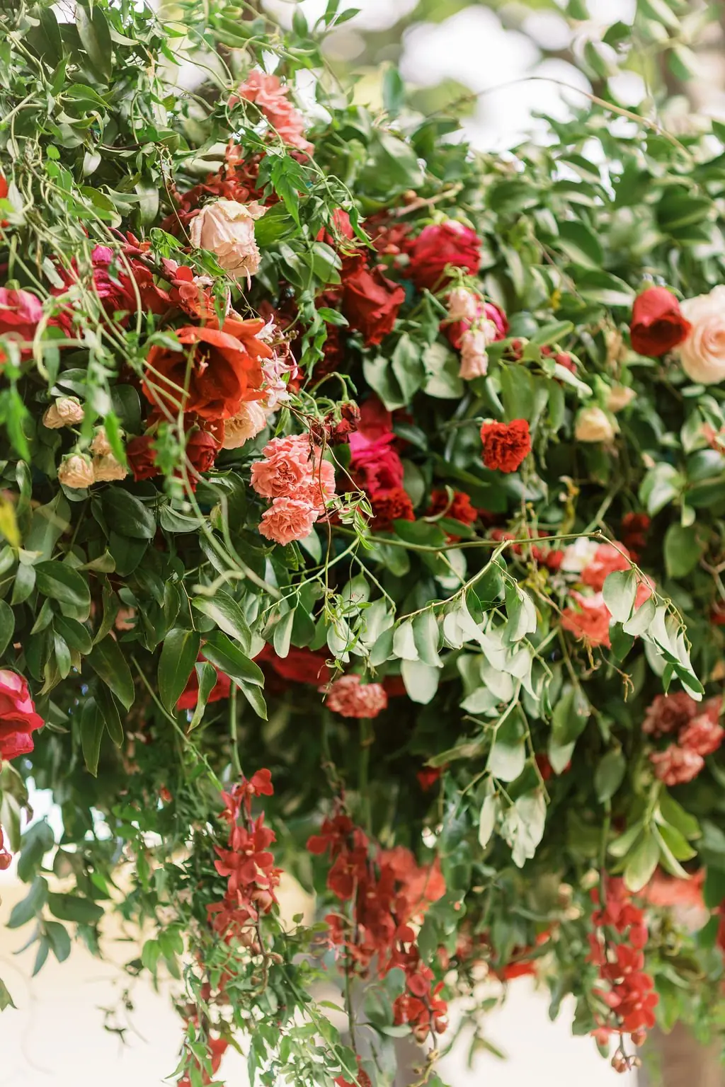Close-up of red and pink floral installation for Valentine's brunch