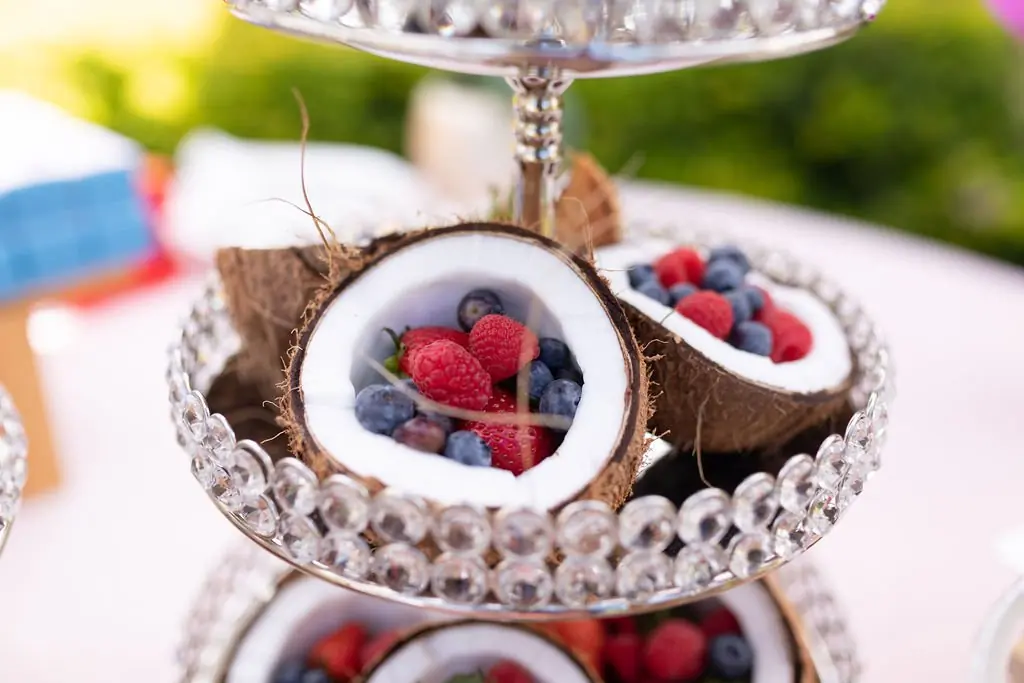 Coconut shells filled with raspberries and blueberries