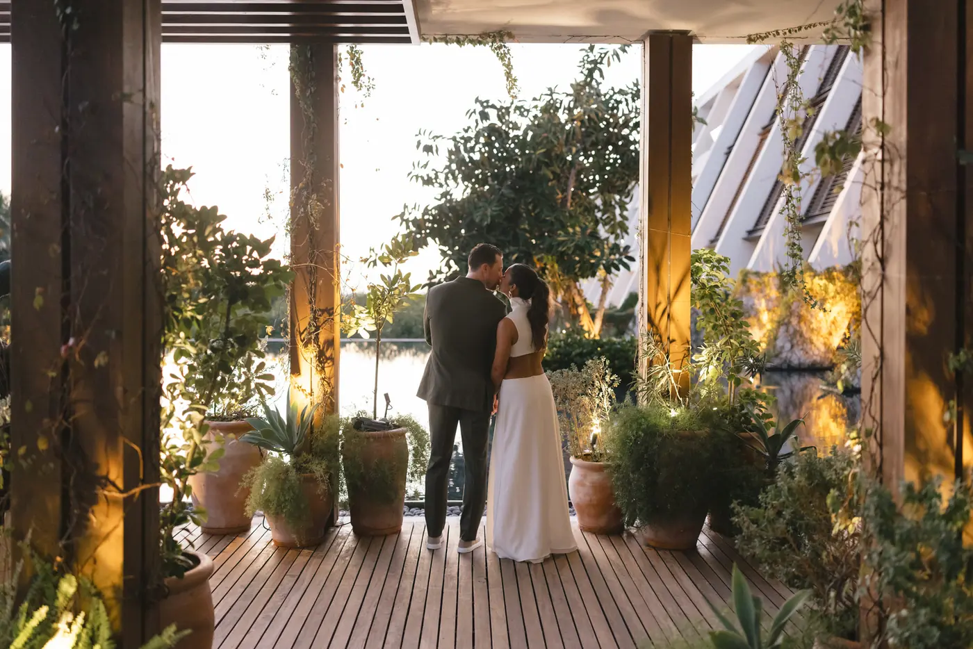 Couple sharing a quiet moment on a lantern-lit terrace at a destination wedding planned by Michigan Avenue Events