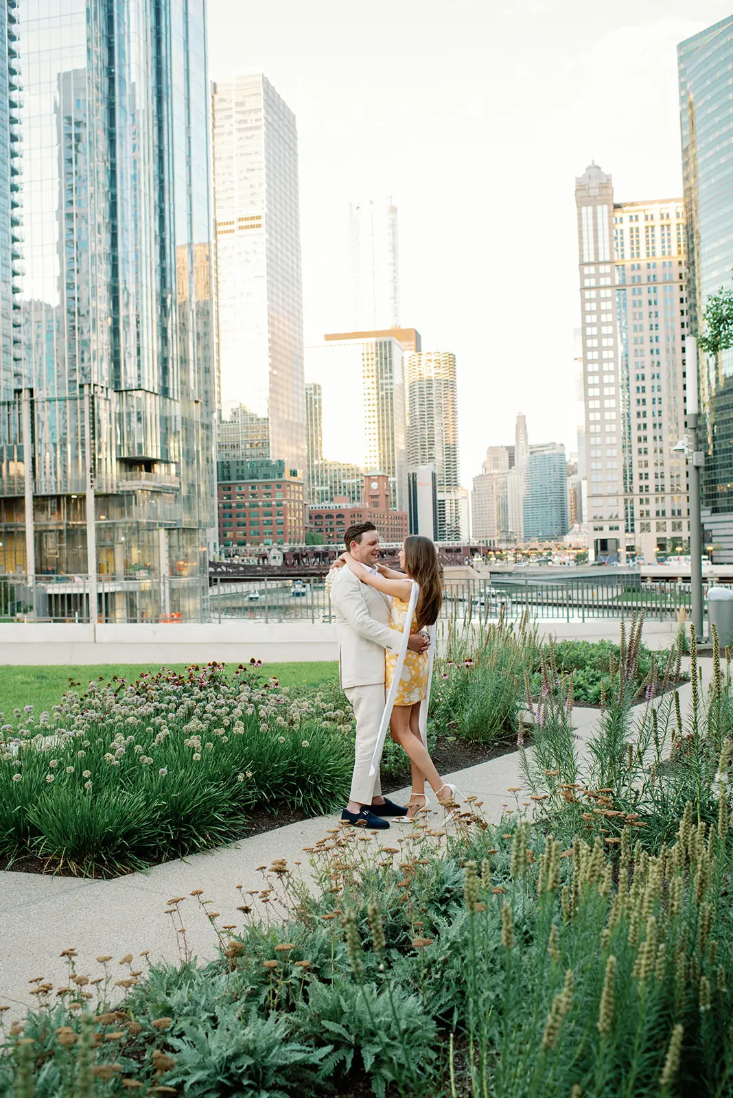 Couple in a rooftop garden against the Chicago skyline at a wedding planned by Michigan Avenue Events
