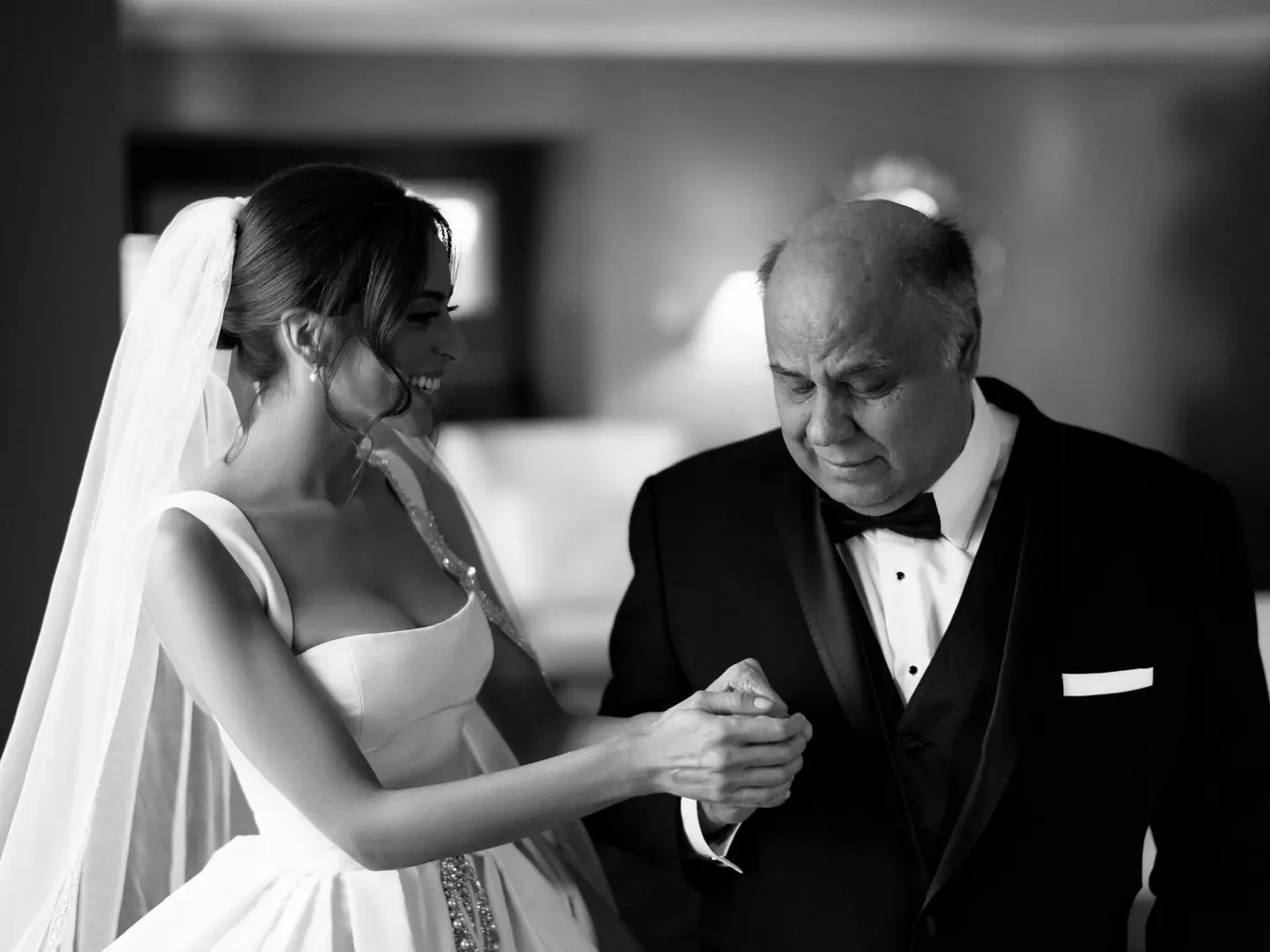 Black-and-white portrait of a bride and her father sharing a quiet moment at a Michigan Avenue Events wedding