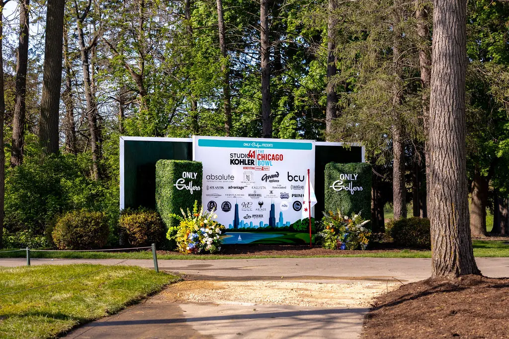 Chicago Bowl outdoor screen set among the trees at an event produced by Michigan Avenue Events
