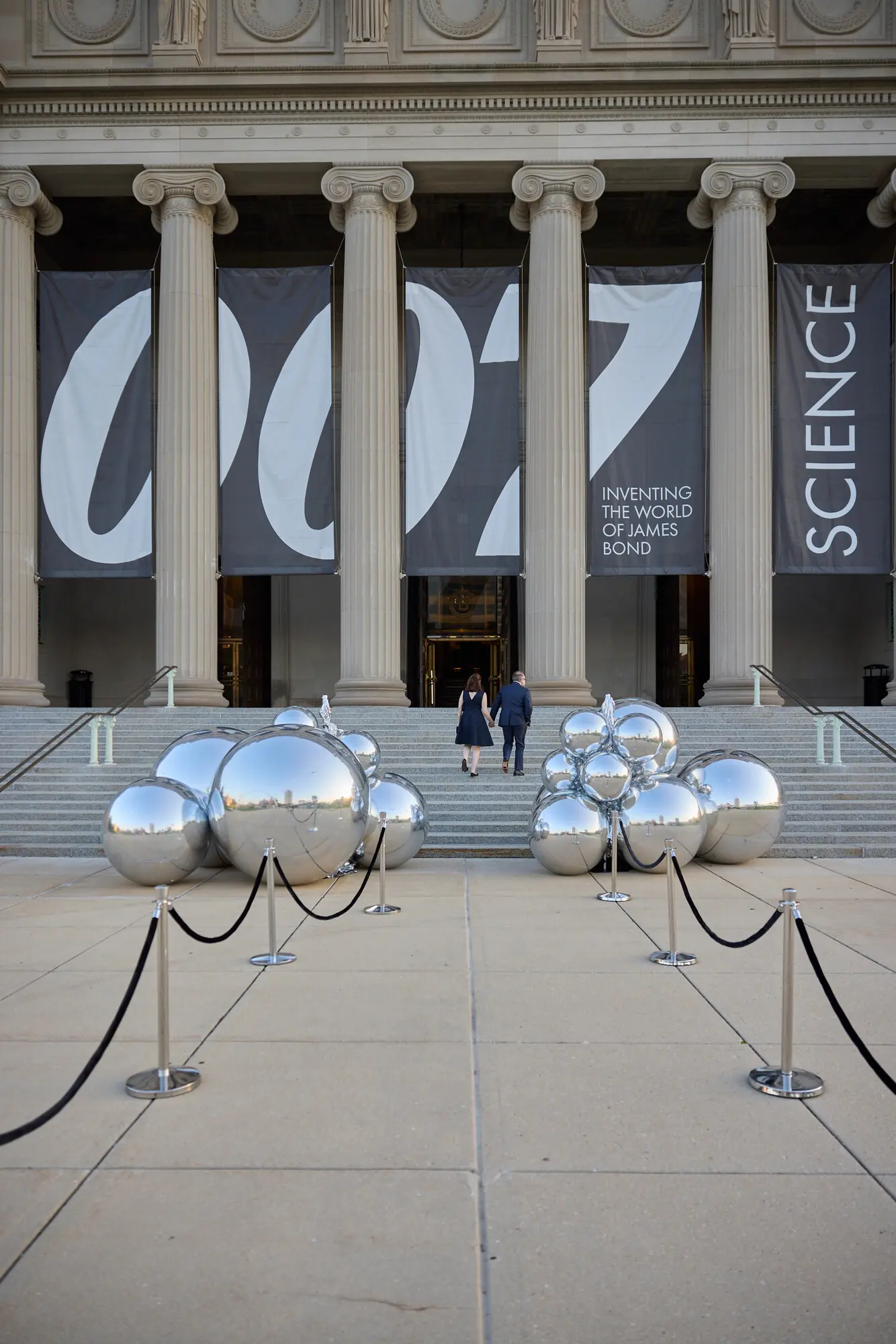 Museum facade with 007 SCIENCE banners and mirrored spheres at a gala produced by Michigan Avenue Events