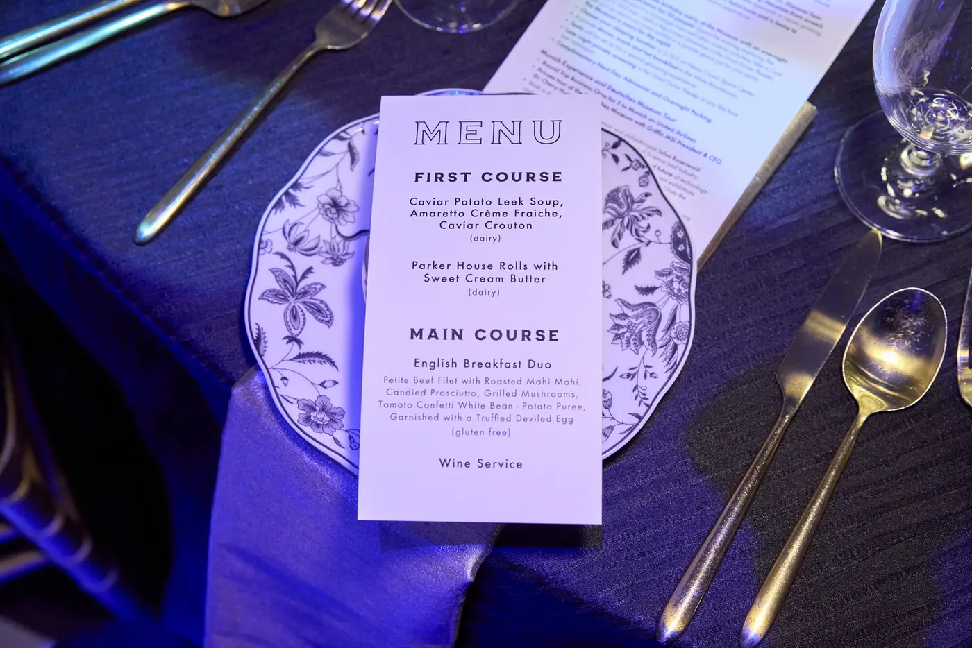 Printed dinner menu at a place setting during the 007 Science gala produced by Michigan Avenue Events