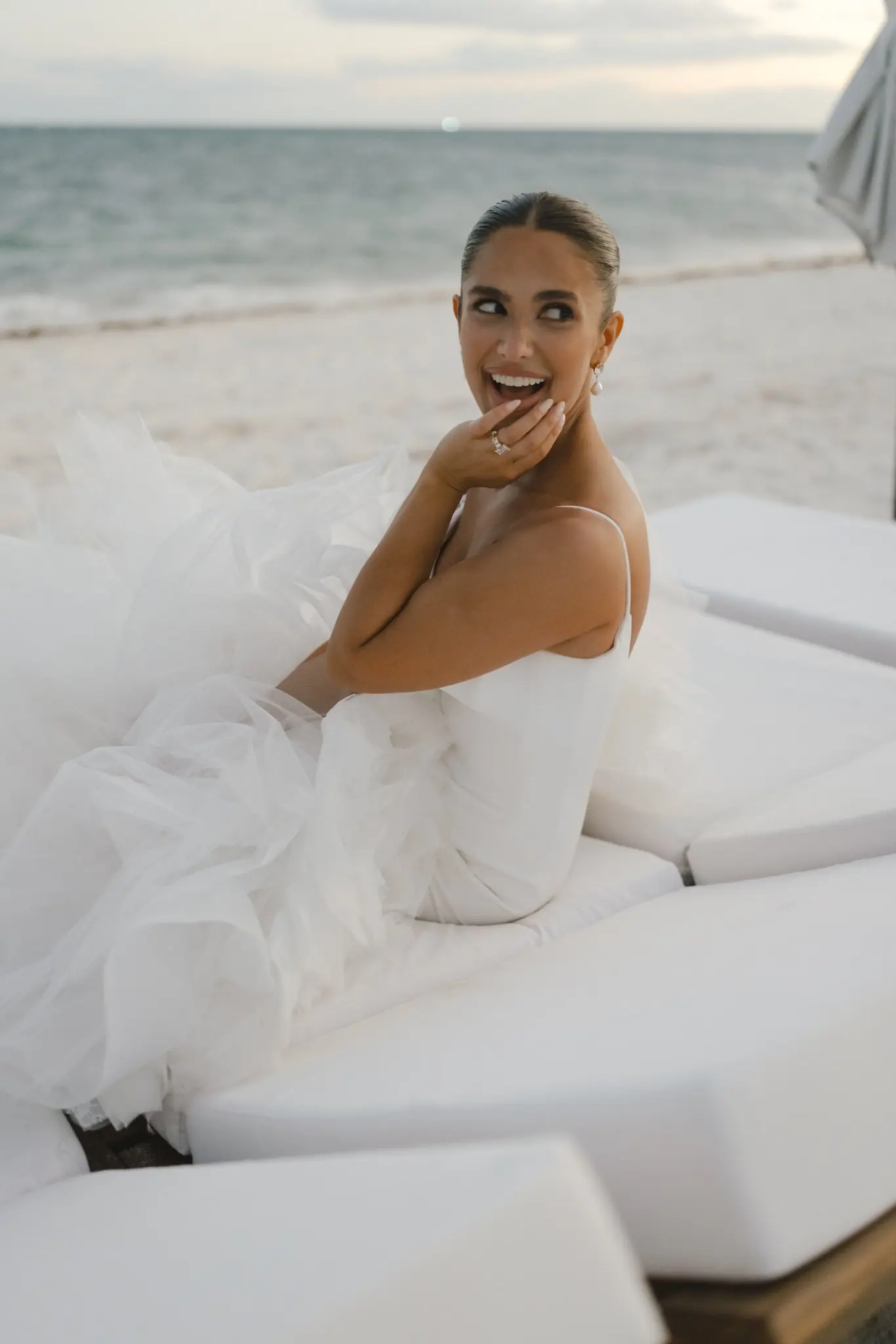 Brooke on the beach at dusk during her St. Regis Kanai wedding weekend