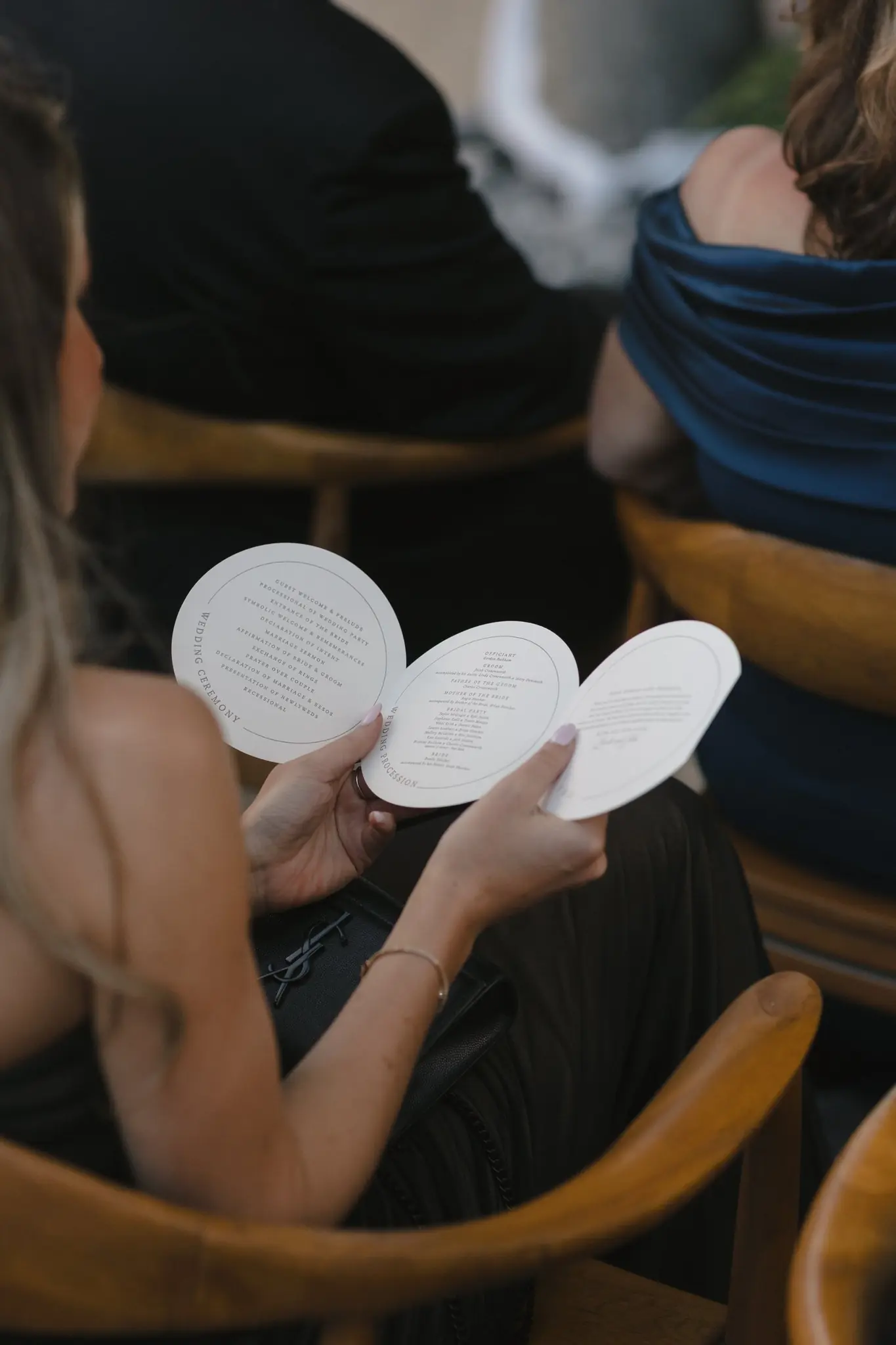 Circular wedding ceremony program at Brooke and Jacob's celebration