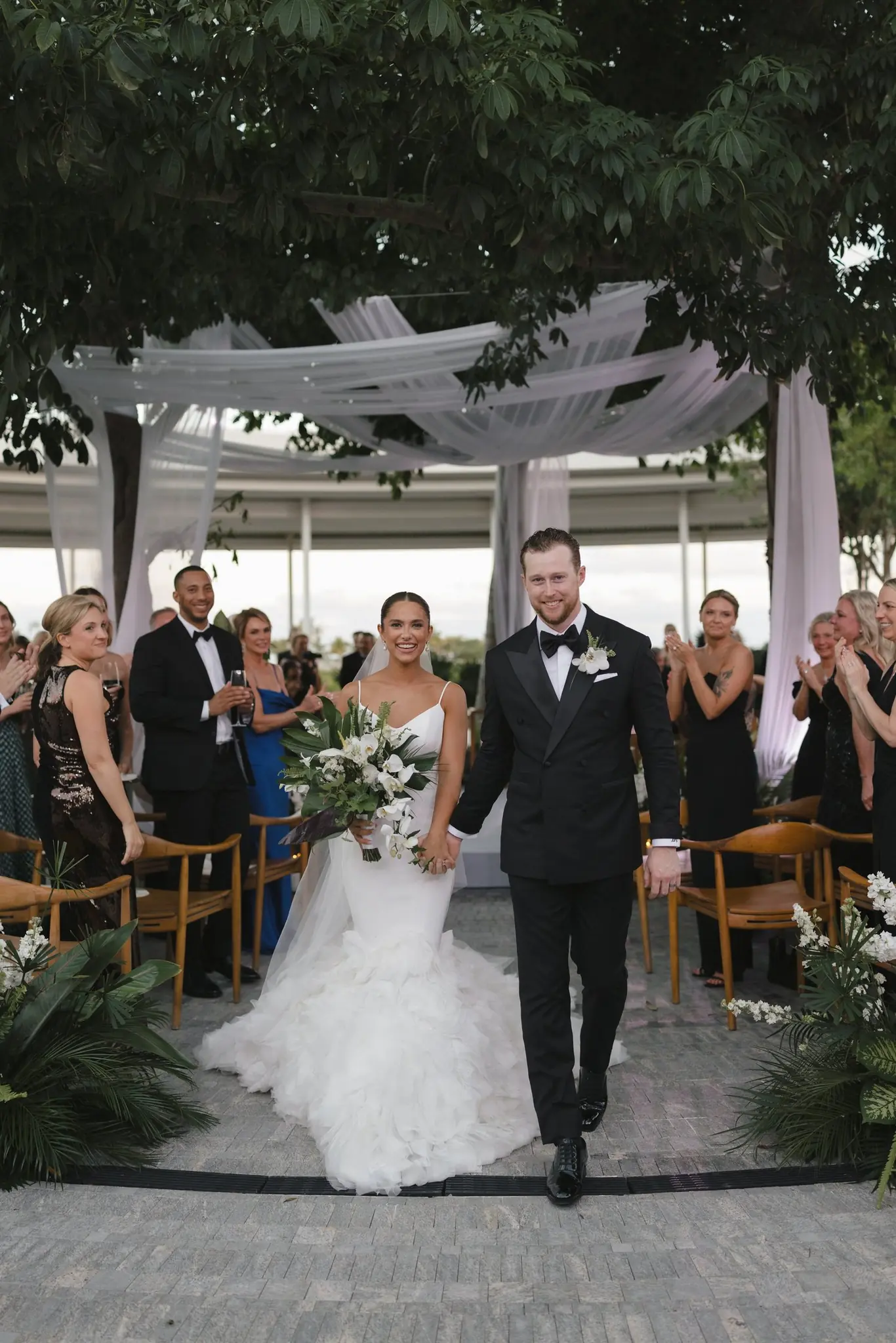 Newlyweds walking the aisle at a Michigan Avenue Events wedding