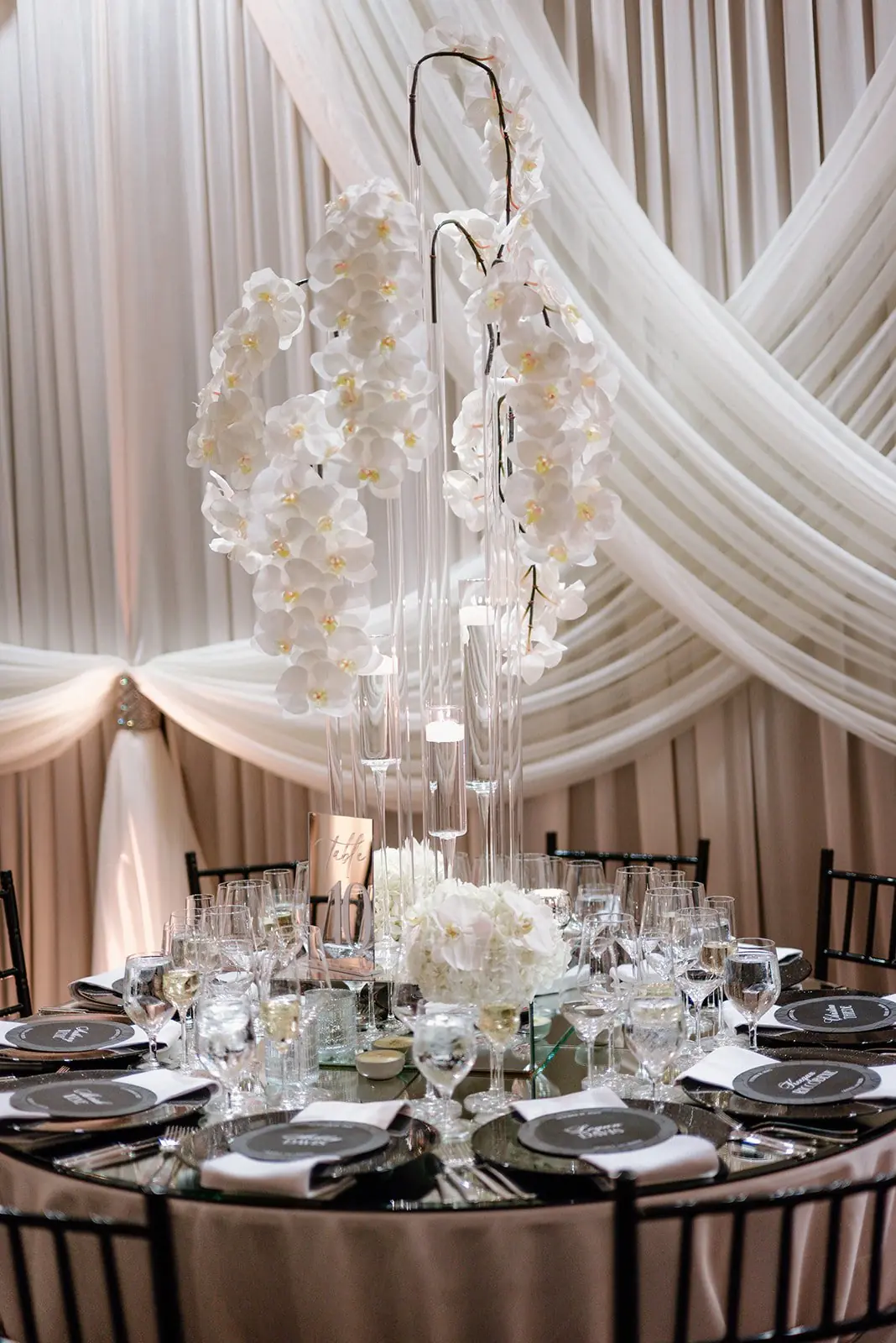 Orchid centerpiece and place settings at Gianna and Austin's reception