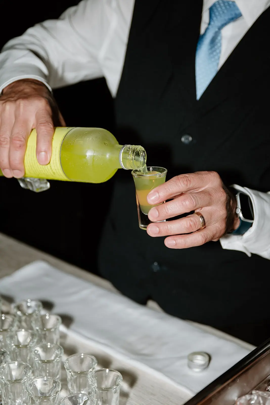 Pouring limoncello shots at Gianna and Austin's wedding reception