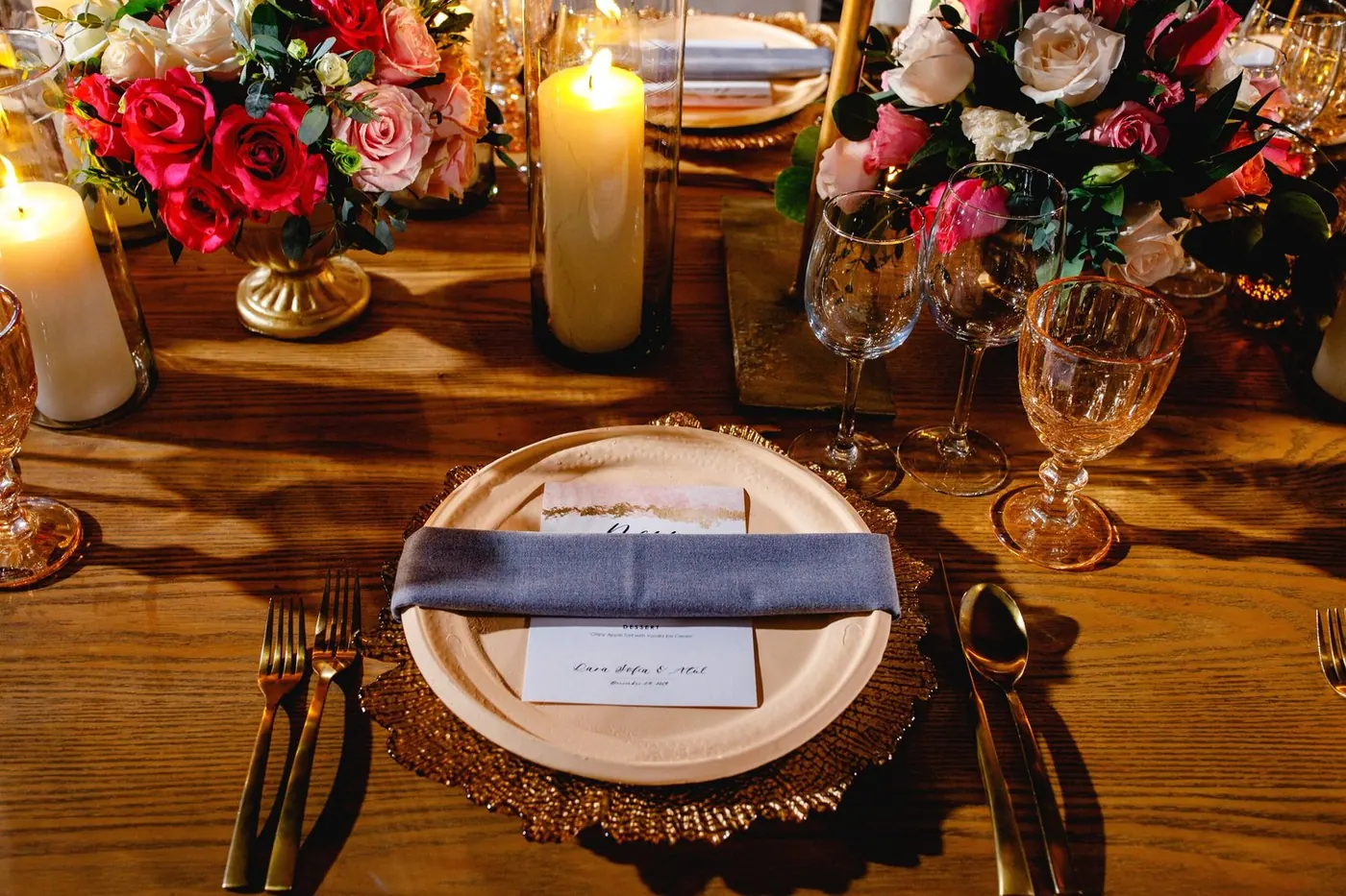 Reception place setting with gold charger and Lara Sofia & Atul menu card