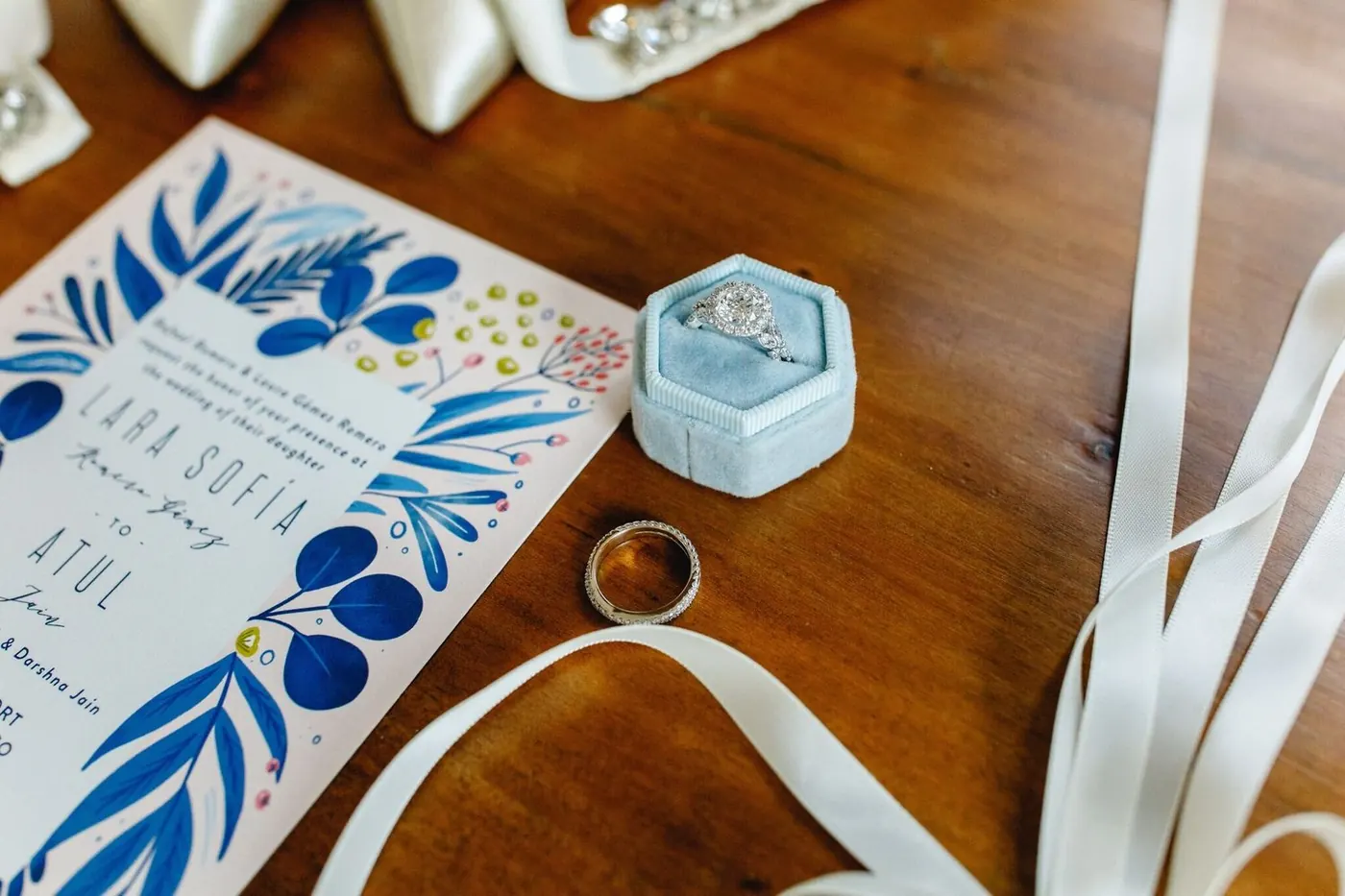 Invitation suite and rings flat lay for Lara Sofia and Atul