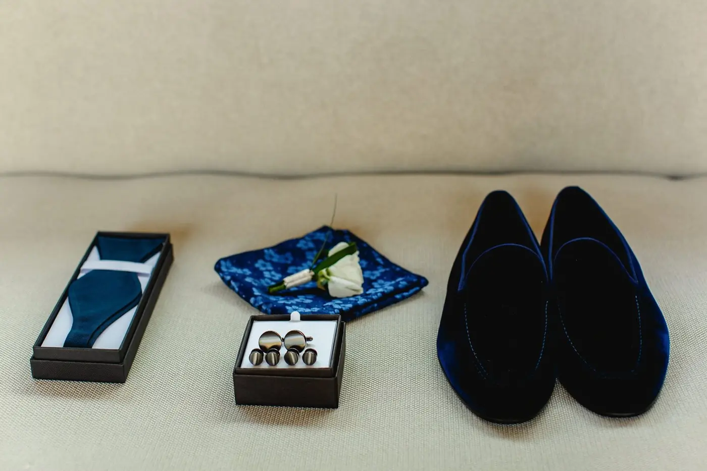 Atul's velvet loafers, cufflinks, and pocket square laid out before the NIZUC ceremony