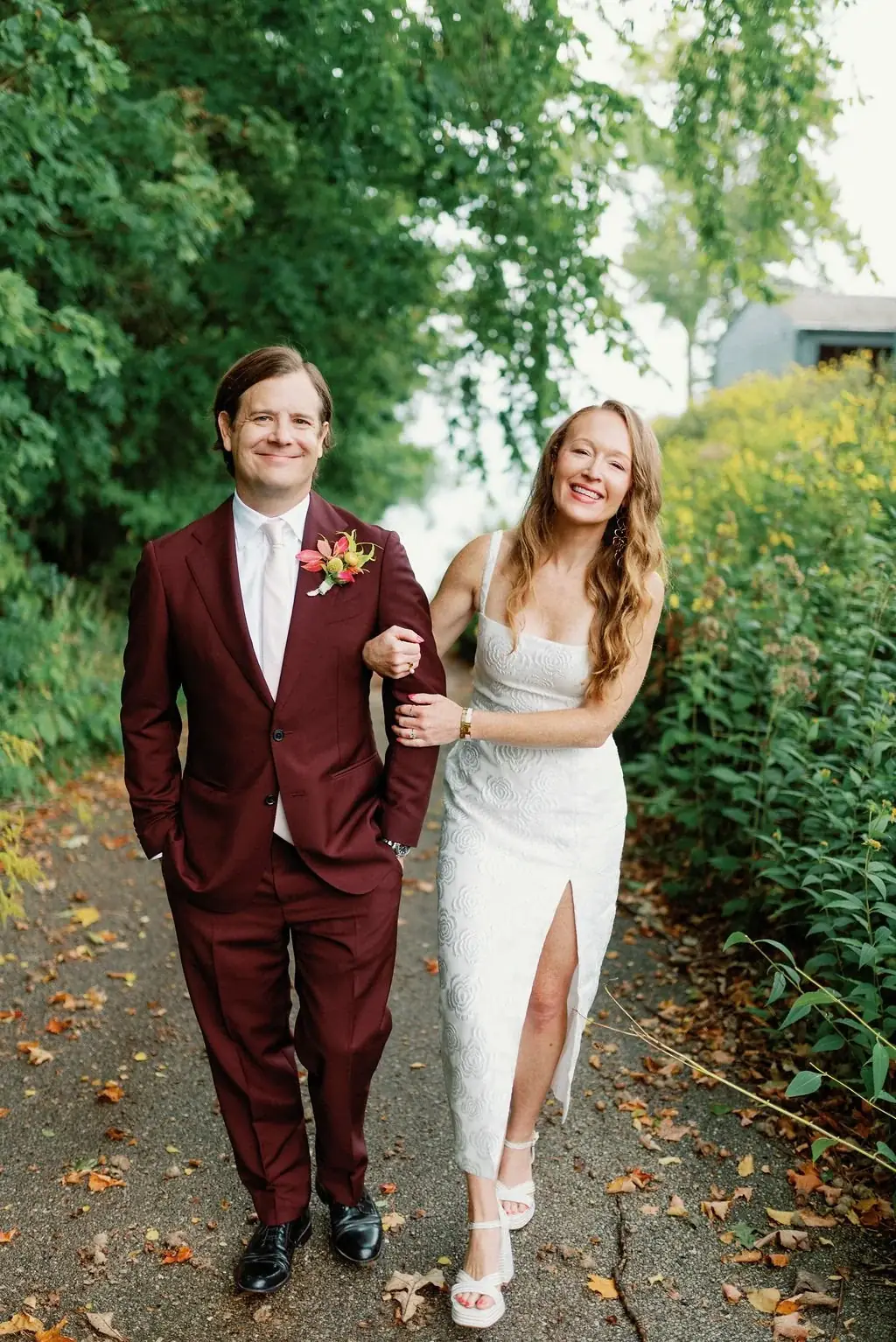 Lisa and Matt walking arm in arm at Shoreacres Country Club, planned by Michigan Avenue Events