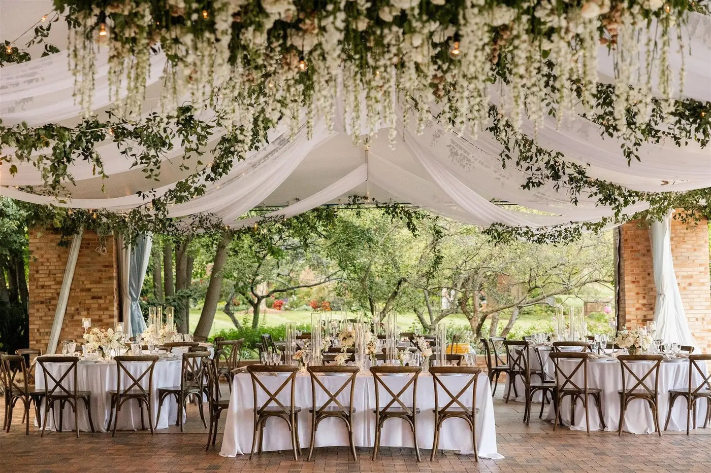 Draped reception pavilion with hanging florals for Megan and Alex