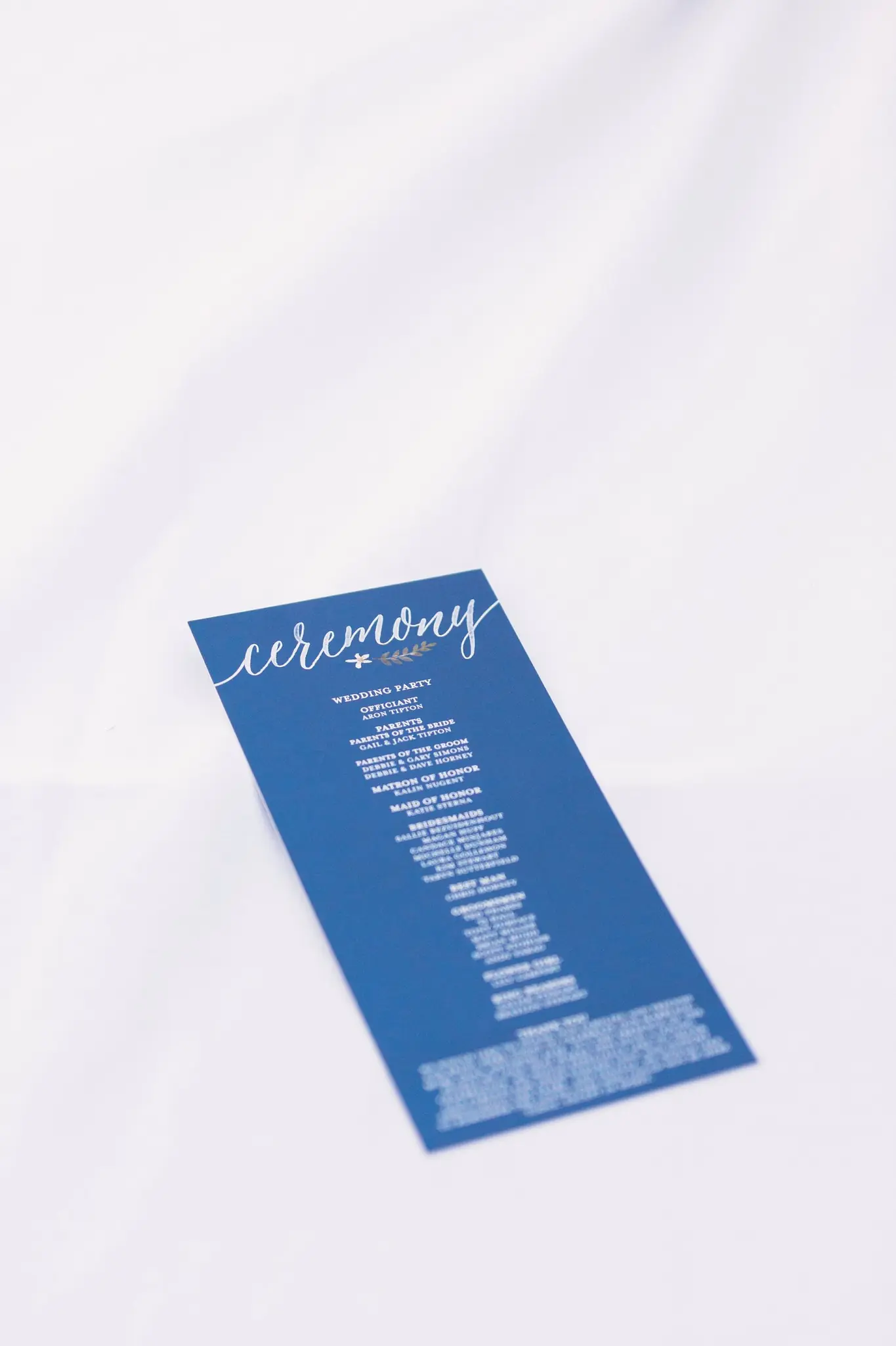 Blue ceremony program for Rian and Matt's Park City wedding