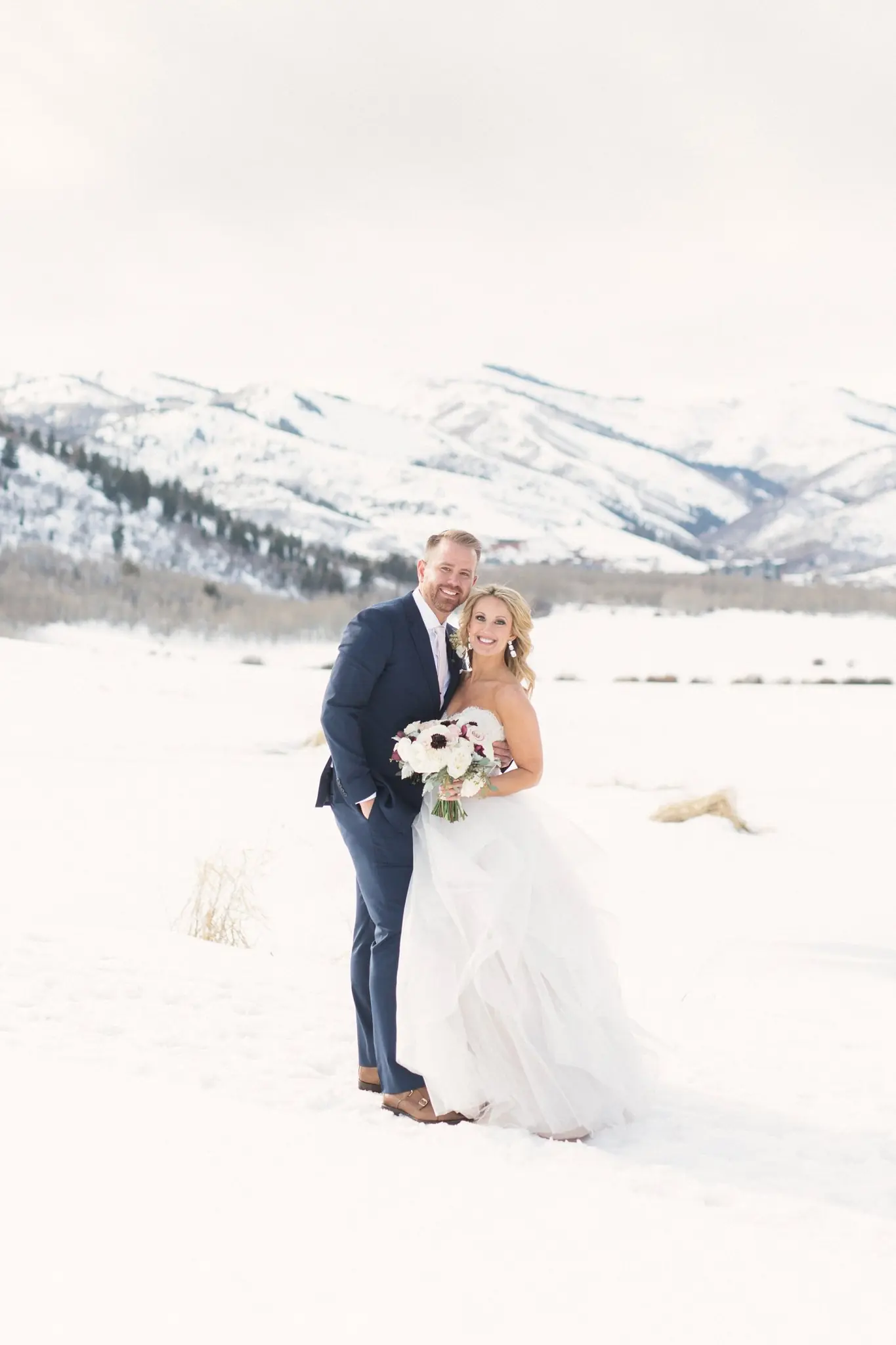 Rian and Matt in the snow at their Park City mountain wedding